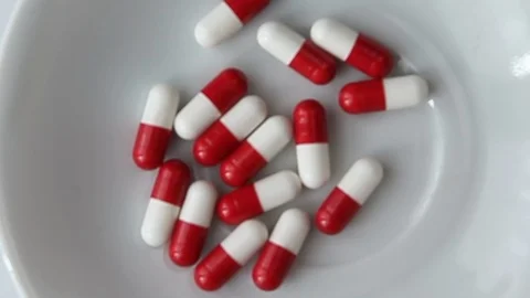 Tablets red &amp; white Stock Footage 105870476