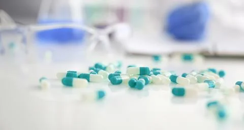 Tablets scattered on the table of the pharmaceutical Stock Photos