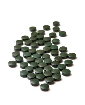 Tablets spirulliny isolation Stock Photos