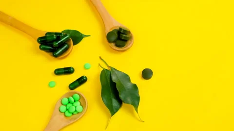 Tablets in spoons. selective focus. Stock Footage 150219163