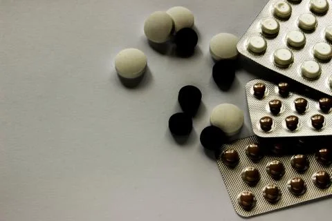 Tablets on the surface in a sealed package on a white surface Stock Photos