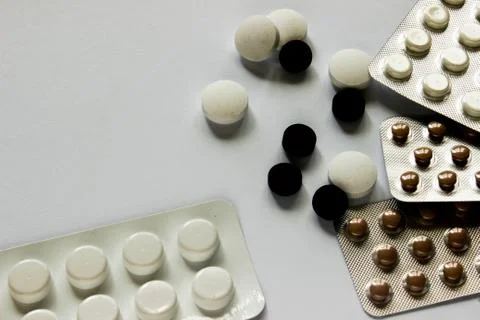 Tablets on the surface in a sealed package on a white surface Stock Photos