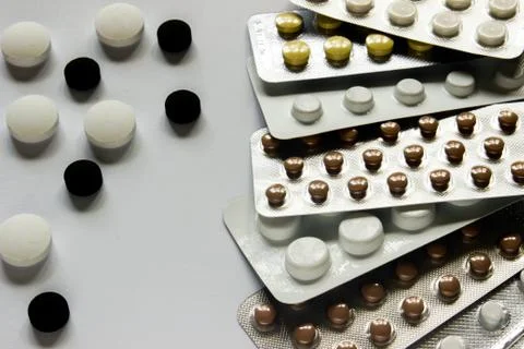 Tablets on the surface in a sealed package on a white surface Stock Photos