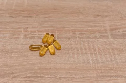 Tablets on the table. yellow pills. Stock Photos
