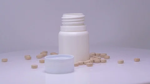 Tablets with white bottle, rotation on a white background Stock Footage 129606964