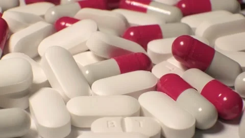 Tablets . white-red tablets. close-up . the concept of health, treatment. Stock Footage 220677252