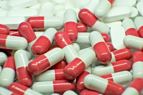 Tablets . white-red tablets. close-up . the concept of health, treatment. Stock-Fotos