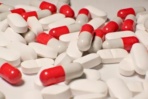 Tablets . white-red tablets. close-up . the concept of health, treatment. Stock-Fotos