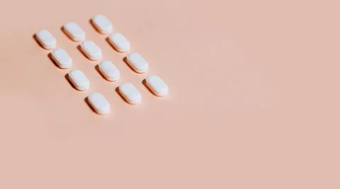 Tablets on a white sheet of paper. Stock Photos