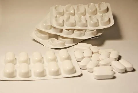 Tablets . white tablets. close-up . the concept of health, treatment. Stock Photos