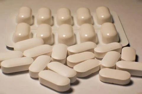 Tablets . white tablets. close-up . the concept of health, treatment. Stock Photos