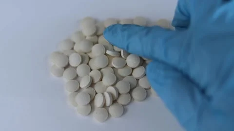 Tablets with zinc on the table. Hand in a glove and pills close-up Stock Footage 170014437