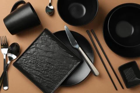 Tableware and cutlery on craft background, top view Stock Photos