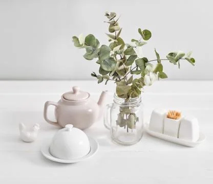 Tableware and decorations for serving festive table on light background. Stock Photos