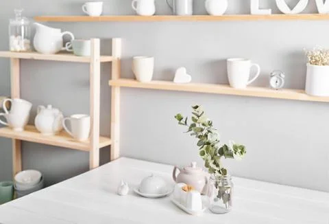 Tableware and decorations for serving festive table on light background.Shelv Stock Photos