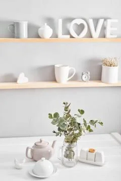 Tableware and decorations for serving festive table on light background. Stock Photos