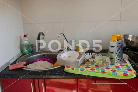 Tableware and dishware drying on towel.Clean dishes and kitchenware drying on a Stock Photos
