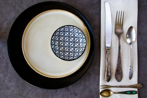 Tableware and dishware setting, plate, folk, knife and bowl Stock Photos