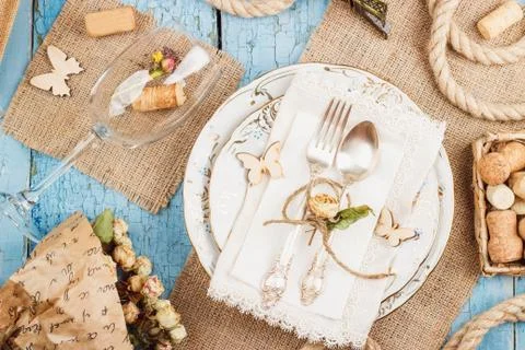 Tableware and silverware with dry flowers Stock Photos