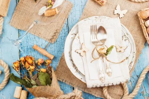 Tableware and silverware with dry flowers Stock Photos