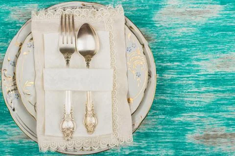 Tableware and silverware on the light blue background Stock-Fotos