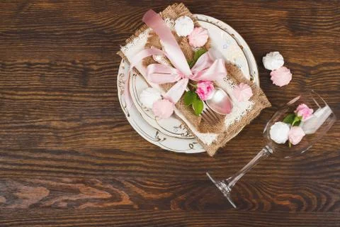 Tableware and silverware with puffy light pink roses Stock Photos