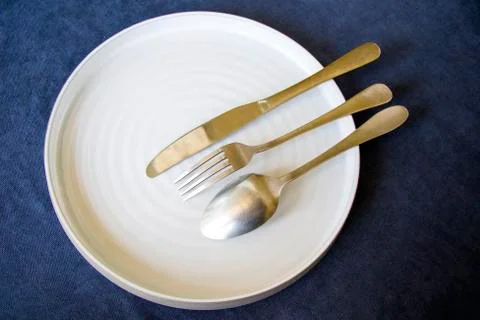 Tableware and tablecloth, knife, spoon and folk Stock Photos