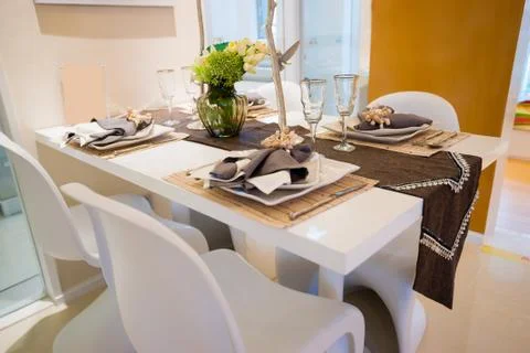 Tableware on dining table Stock Photos