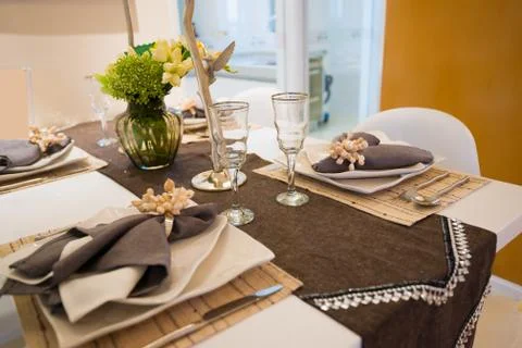 Tableware on dining table Stock Photos