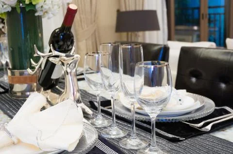 Tableware on dining table Stock Photos