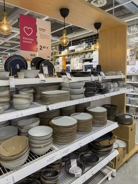 Tableware display shelves in IKEA store with plates and bowls Stock Photos