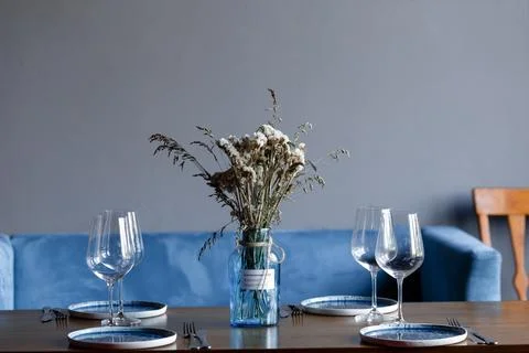 Tableware Glasses, flower fork, knife served for dinner in restaurant with cozy Stock Photos