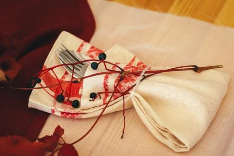 Tableware on kitchen table with autumn decor close up Stock Photos