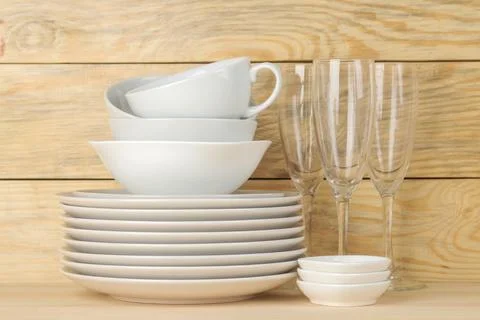 Tableware on a wooden background. Clean tableware. Stock Photos