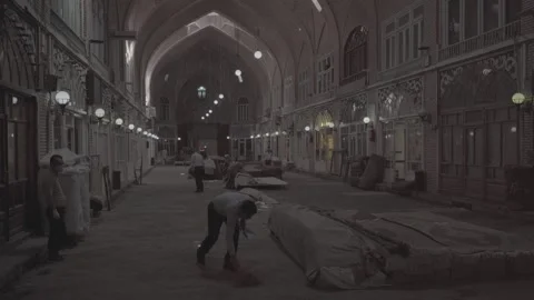 Tabriz Bazaar Iran Mozaffarieh Timche Sweeping Vendors Pan Shot (RAW COLOR) Stock Footage 331594761