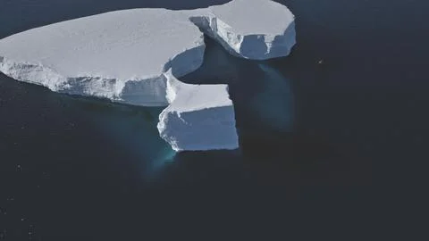 Tabular iceberg float antarctic clear water aerial Stock Photos