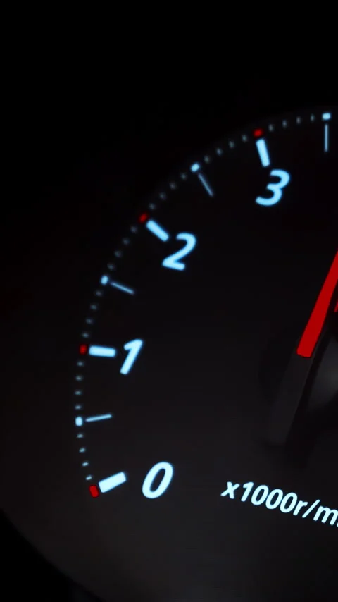 Tachometer of a modern car reacts to hard accelerations by the driver, who is Stock Footage 306503962