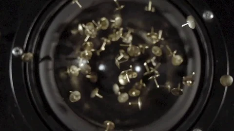 Tacks dancing in a speaker in slow motion topshot Stock Footage 81817104