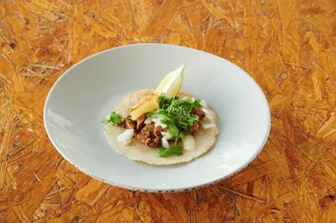A taco with a lime on top of it Stock Photos