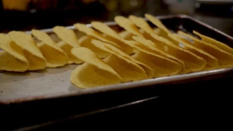 Taco night hard shell tortilla tacos ready to be dressed and prepared   Stock Footage 103221678