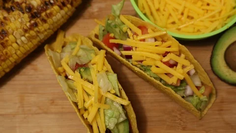 Taco Tuesday Vertical Shot of Corn Tortilla Hot Sauce Cheese Avocado Salsa Video stock 127939660