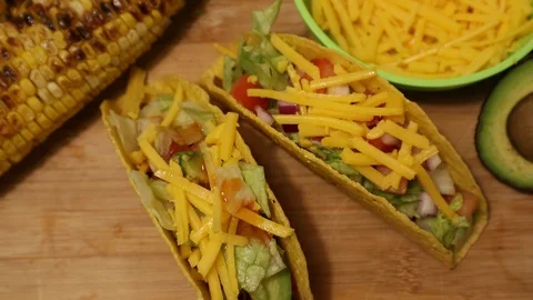 Taco Tuesday Vertical Shot of Corn Tortilla Hot Sauce Cheese Avocado Salsa Stock Footage 127939682