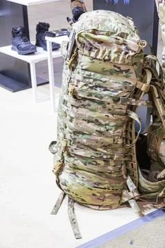 Tactical backpack with camouflage pattern, multiple compartments, sturdy fa.. 写真素材