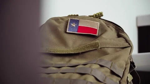 Tactical backpack with Texas flag patch in the interior of a private house Stock Footage 184971044