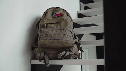 Tactical backpack with Texas flag patch in the interior of a private house Stock Footage 185070290