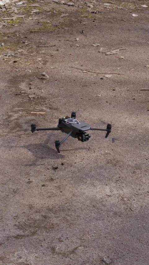 Tactical drone hovering against pine forest background KYIV, SEPTEMBER 27, 2025 Stock Footage 333612814