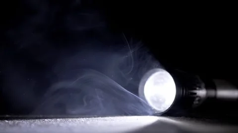 Tactical Flashlight Beam Shining Through Mysterious Smoke On Ground Vídeos de archivo 330116386