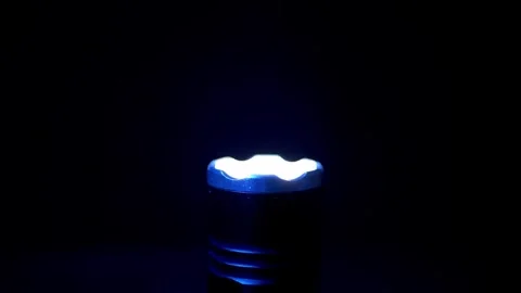 Tactical LED Flashlight Strobing Bright Light In Pitch Darkness For Emergency Stock Footage 330116322