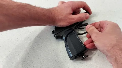 Tactile Gun Handling: Trigger and Grip Area in View Stock Footage 322151102