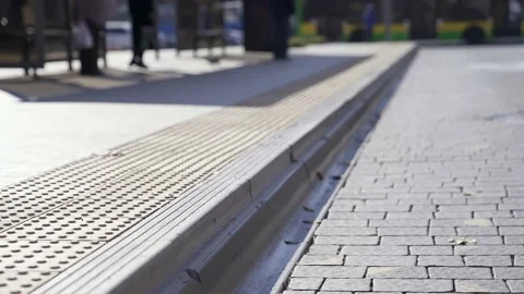 Tactile tiles on edge of road. Stock Footage 205869822